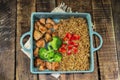 Fried rice with chicken breast has vegetable in blue tray on table Royalty Free Stock Photo