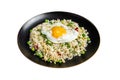 Fried rice with chicken, egg and vegetables in a plate. Isolated on white background. Royalty Free Stock Photo