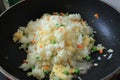 Fried rice cooking in hot iron pan. Asian food ingredient Royalty Free Stock Photo