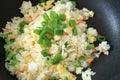 Fried rice cooking in hot iron pan. Asian food ingredient Royalty Free Stock Photo