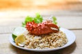 Fried Rice crab seafood / Healthy food fried rice with Crab claw with egg lemon and cucumber on white plate wooden table Royalty Free Stock Photo