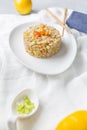 Fried rice dish with vegetables such as squash, carrots, bell peppers and Chinese spices