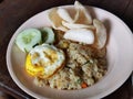 Fried rice with egg and crackers on white plate Royalty Free Stock Photo