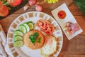 Fried Rice with Fried Egg Put on the wooden table and the tomatoes, cucumbers, garlic, shallots. Royalty Free Stock Photo