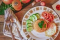 Fried Rice with Fried Egg Put on the wooden table and the tomatoes, cucumbers, garlic, shallots. Royalty Free Stock Photo