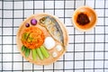 Fried rice with prik pao Chilli paste with soya bean oil, omelet with cha om, boiled chicken egg, cucumber, eggplant and fried Royalty Free Stock Photo