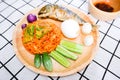 Fried rice with prik pao Chilli paste with soya bean oil, omelet with cha om, boiled chicken egg, cucumber, eggplant and fried Royalty Free Stock Photo