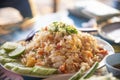 fried rice shrimp egg with seafood cucumber lime on plate on the table outdoors thai style food Royalty Free Stock Photo