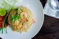 Fried rice with shrimp in a white dish on wood table in thai foo Royalty Free Stock Photo