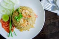 Fried rice with shrimp in a white dish on wood table in thai foo Royalty Free Stock Photo