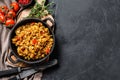 Fried Rice with Vegetables and eggs. Chinese Cuisine. Black background. Top view. Copy space