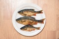 Fried river fish on the plate