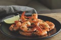 Fried roasted shrimps in frying pan with lemon greens parsley garlic Royalty Free Stock Photo