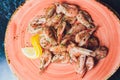 Fried roasted shrimps in plate with lemon greens parsley garlic. Royalty Free Stock Photo