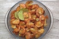 fried roasted shrimps in plate with lime pils in a big glass plate on grey background Royalty Free Stock Photo