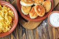 Fried russian pastry pirozhki on wooden background.