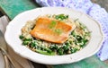 Fried salmon with brown rice, spinach and leguminous kidney bean