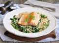 Fried salmon with brown rice, spinach and leguminous kidney bean