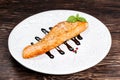 Fried salmon fillet served with reduced balsamic vinegar Royalty Free Stock Photo