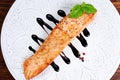 Fried salmon fillet served with reduced balsamic vinegar Royalty Free Stock Photo