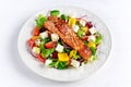 Fried Salmon steak with fresh vegetables salad, feta cheese. concept healthy food. Royalty Free Stock Photo