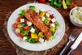 Fried Salmon steak with fresh vegetables salad, feta cheese. concept healthy food. Royalty Free Stock Photo