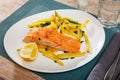 Tasty grilled salmon served with french fries Royalty Free Stock Photo