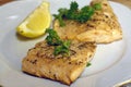 Fried salmon or trout fish fillets with dill and slice of lemon Royalty Free Stock Photo