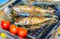 Fried salted fish and red potatos on plate Royalty Free Stock Photo