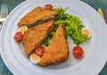 Montenegrin fried sandwich, fritter, with goat cheese and Njeguski prsut meat with tomatoes, boiled quail egg and salad