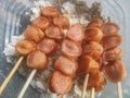 Fried sausage satay which is ready to be coated with flour Royalty Free Stock Photo