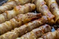 Fried sausages in bacon. bacon roll closeup. Abstract background with bacon Royalty Free Stock Photo
