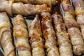 Fried sausages in bacon. bacon roll closeup. Abstract background with bacon Royalty Free Stock Photo