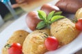 Fried sausages and breaded potatoes Royalty Free Stock Photo