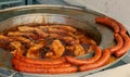 Fried sausages on metal plate