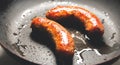 Fried sausages on the pan. Unhealthy breakfast. English and German style cuisine