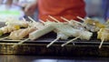 Fried sausages and vegetable, mushrooms on the grill. Traditional street food asia, night food market. 3840x2160 Royalty Free Stock Photo