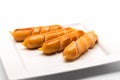 Fried sausages on a white plate on white Royalty Free Stock Photo