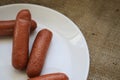 Fried sausages on a wooden board Royalty Free Stock Photo