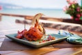 Fried sea crab served with lettuce, bread and sauce in chili pepper on beach Royalty Free Stock Photo