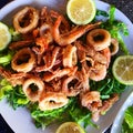 Fried seafood on bed of lettuce leafs