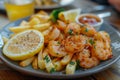 Fried shrimp and french fries plate garnished Royalty Free Stock Photo