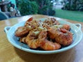 Fried shrimp with garlic and pepper, fresh seafood, sweet taste of shrimp meat, onion, garlic and pepper