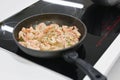 Fried shrimp in a pan. cook on electric stove Royalty Free Stock Photo