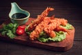 Fried shrimp, peeled in tempura, soy sauce, close-up, on a wooden board, Royalty Free Stock Photo