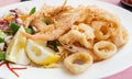 Fried shrimp and squid with lemon. Royalty Free Stock Photo