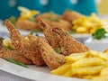 FRIED SHRIMPS with french fries served in dish isolated on table closeup top view of grilled seafood Royalty Free Stock Photo