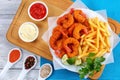 Fried Shrimps, lime wedges, french fries Royalty Free Stock Photo