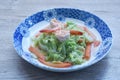 fried slice cabbage and carrot with shrimp in soy sauce on plate