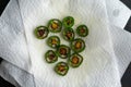 Fried Slices of Jalapeno Peppers Draining on Paper Towels Royalty Free Stock Photo